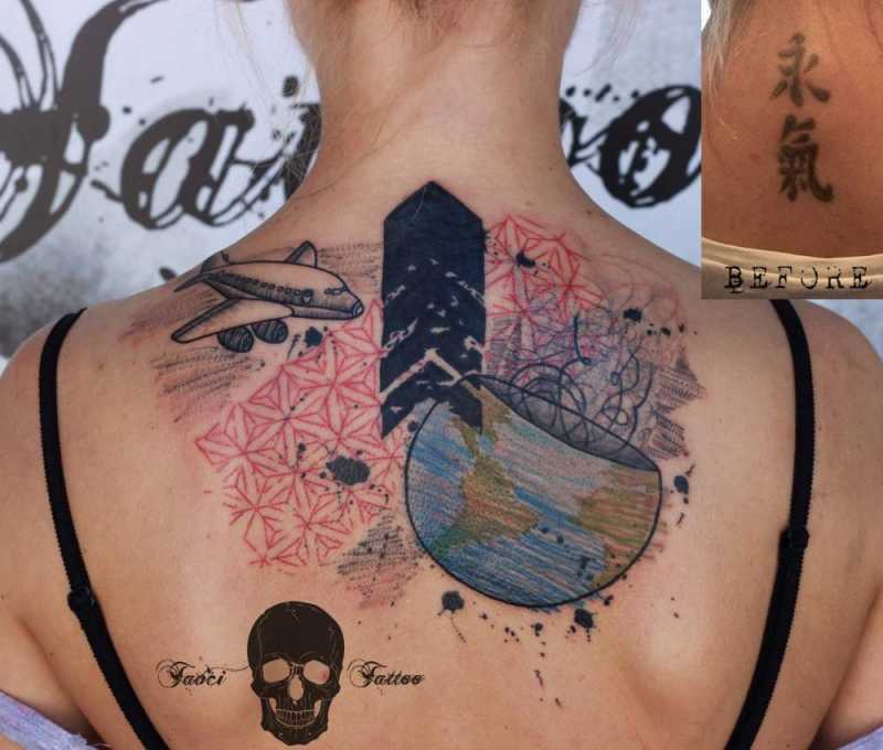 Graphic style cover up tattoo on the upper back.