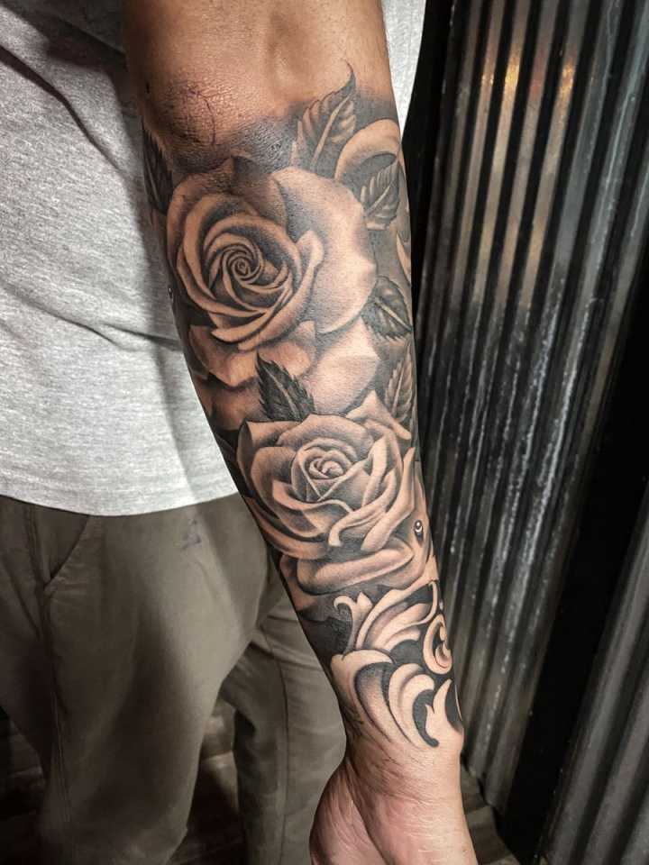 Roses flowers tattoo forearm half sleeve man  Rose tattoos for