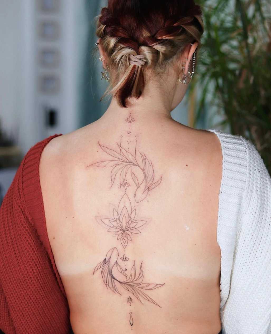 The Art of Self-Expression: Feminine Back Tattoos  by Anastasiia