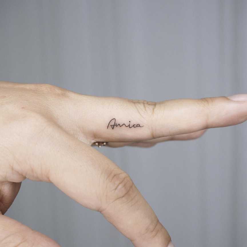 Tiny name finger tattoo  Hand and finger tattoos, Finger tattoos